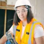 Handywoman Holding a Plumbers Wrench