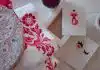 white and red floral textile